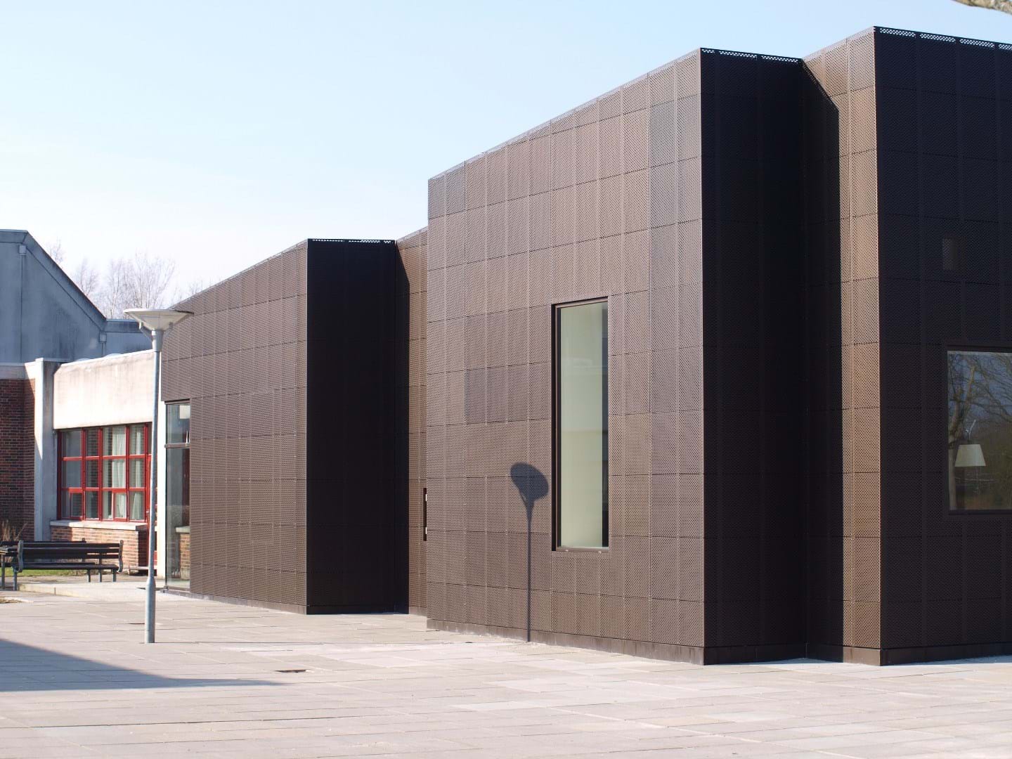 Allerød High School with facade made of perforated aluminum plates.